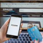 Woman Using Her Credit Card And Cellphone to Buy Amazon Products